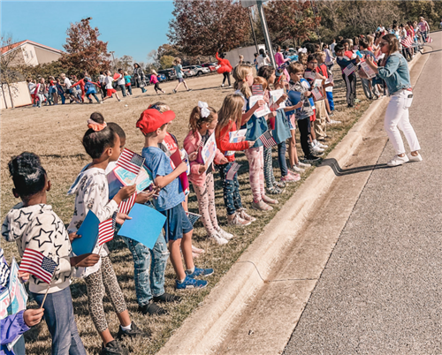 kids lining parade route at Columbia Elementary